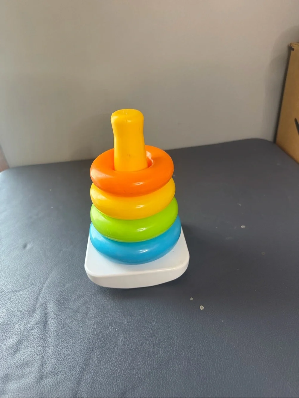 Fisher-Price Colorful Stacking Rings Toy has some flaws and missing parts